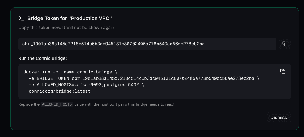 The Connic dashboard Bridge panel showing a freshly generated cbr_ token and a ready-to-run docker run command for the bridge agent.
